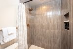 The custom tile shower provides a spa-like retreat after a day on the mountain.